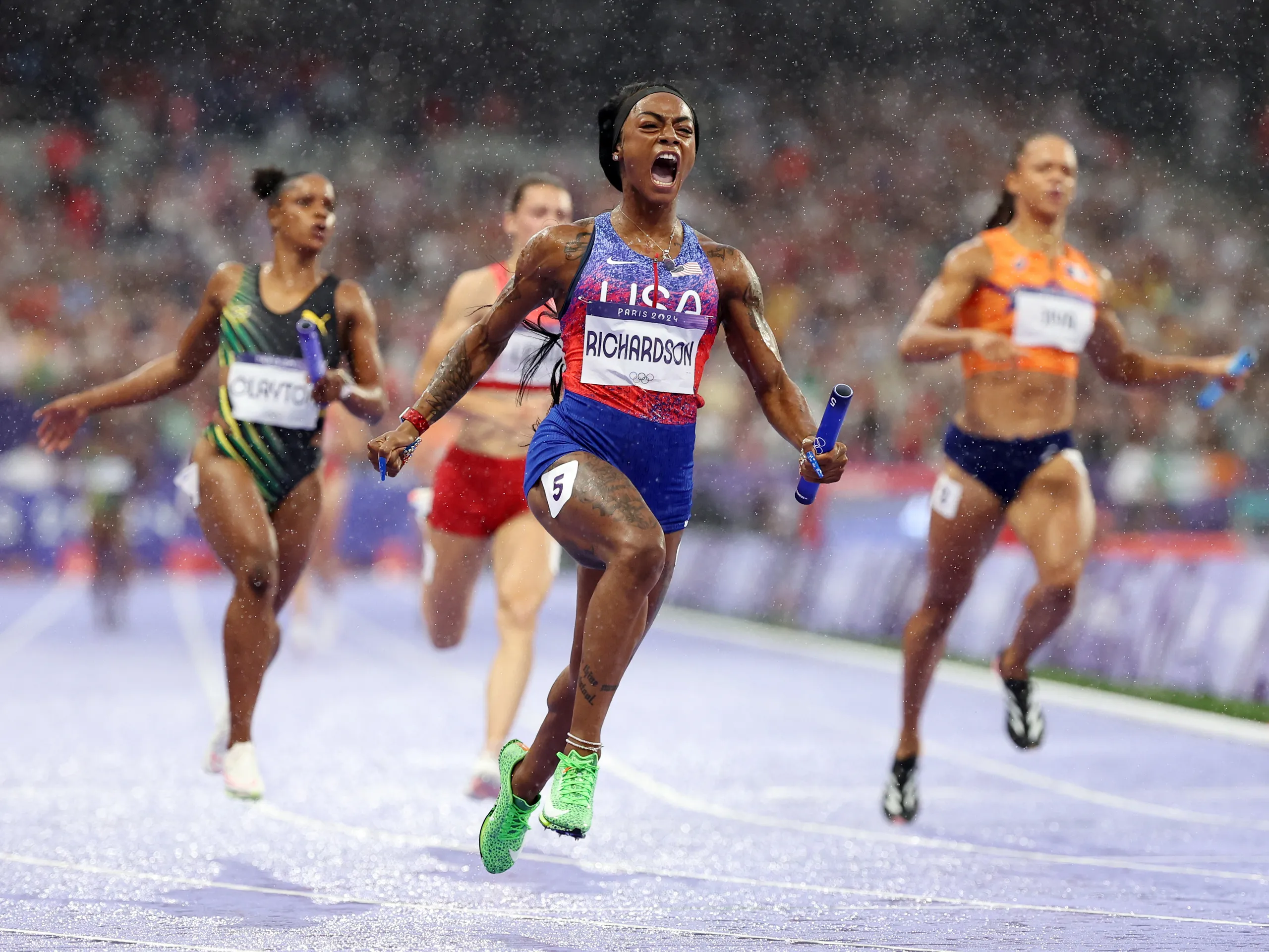 US Olympian Richardson running with baton