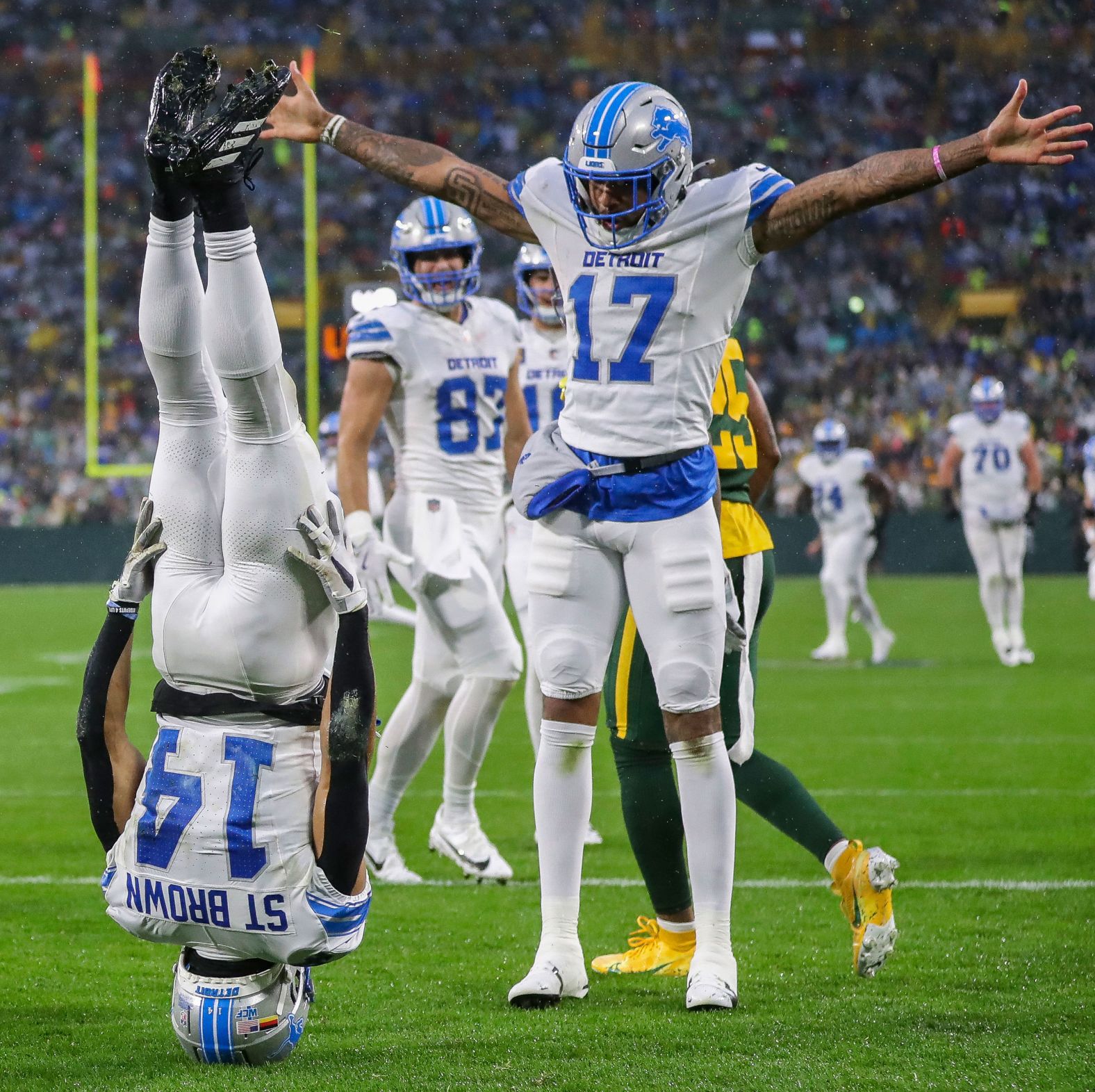 Lions wide receiver celebrating touchdown with a headstand
